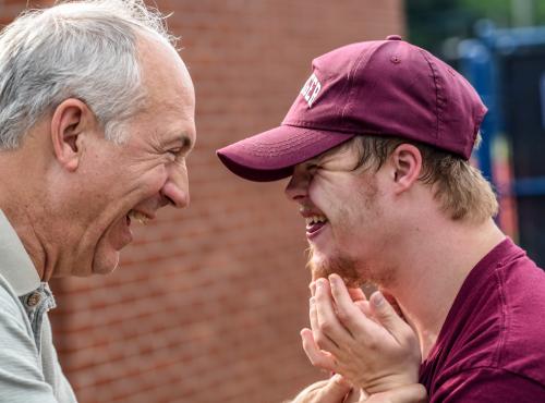 Two people smiling at each other