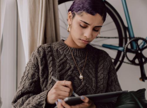 Woman drawing on tablet