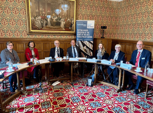 Panellists sitting around horse shoe table