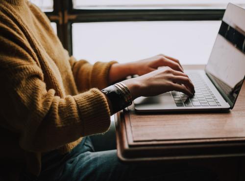 Person typing on a laptop