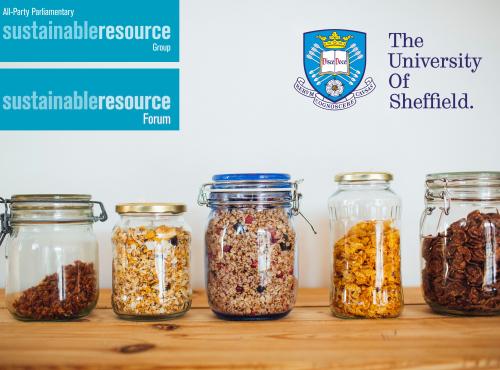 Shelf with line of glass jars containing a variety of dry store food goods