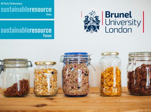 Shelf with line of glass jars containing a variety of dry store food goods