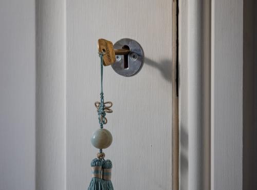 A key ready to turn in a door