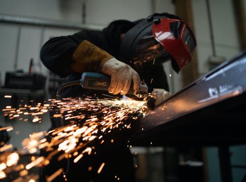 Person working with metal manufacturing