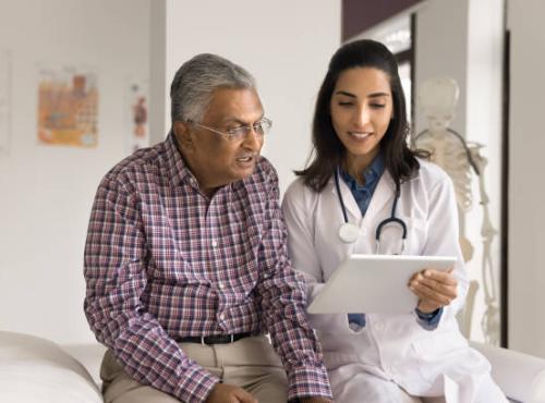 Patient and Doctor reading a report