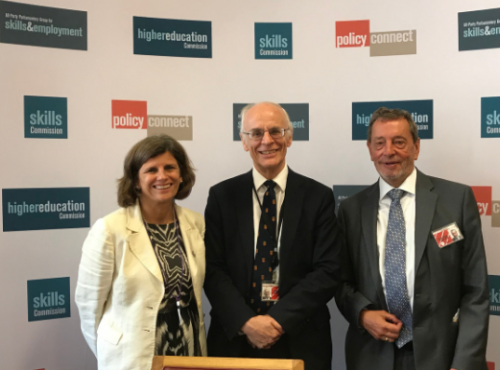 Kathryn Mitchell (VC University of Derby), Lord Norton and Lord Blunkett standing and smiling in front of the Policy Connect / HE Commission banner