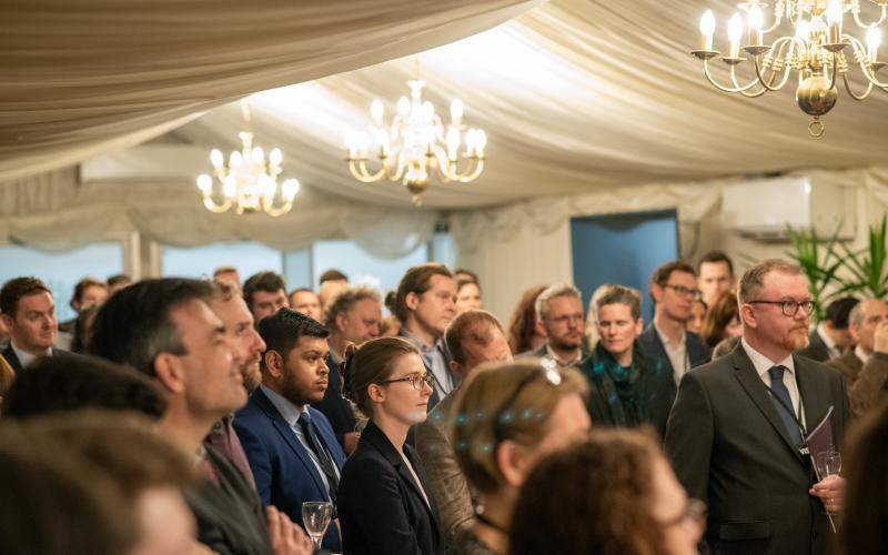 Attendees listening to speeches