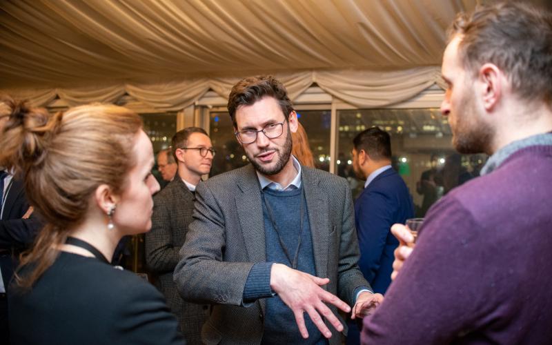 Attendees chatting at the event