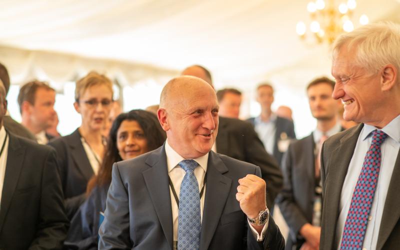 Stephen Phipson speaking to guests, smiling and clasping his fist in the air