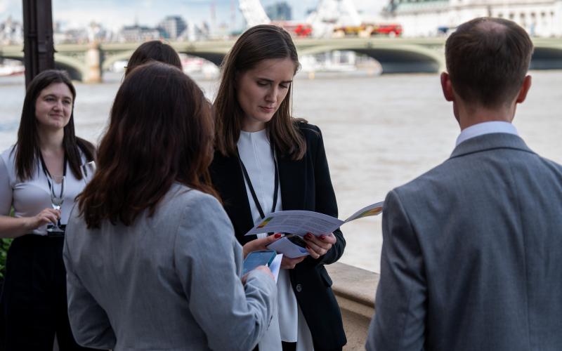 Guests reading ESA report at terrace